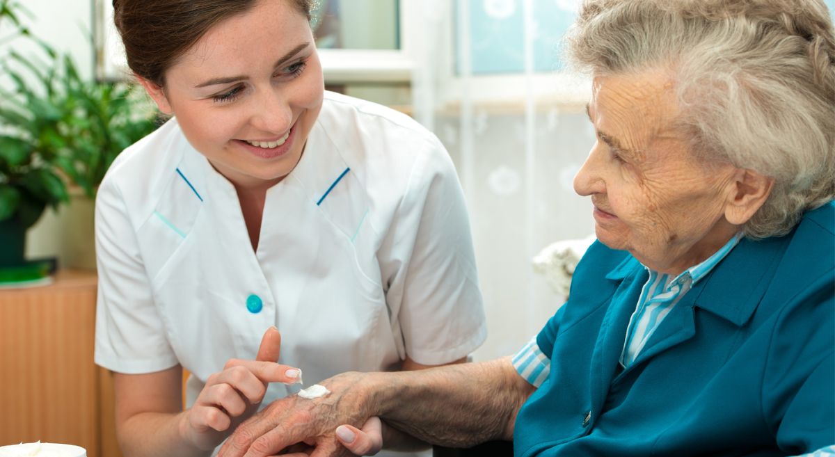 a nurse caring for an elderly lady